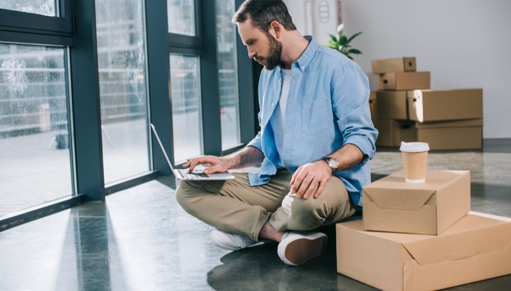 Office Relocation: 5 Common Mistakes bearded businessman using laptop while sitting on 2021 08 31 03 42 27 utc